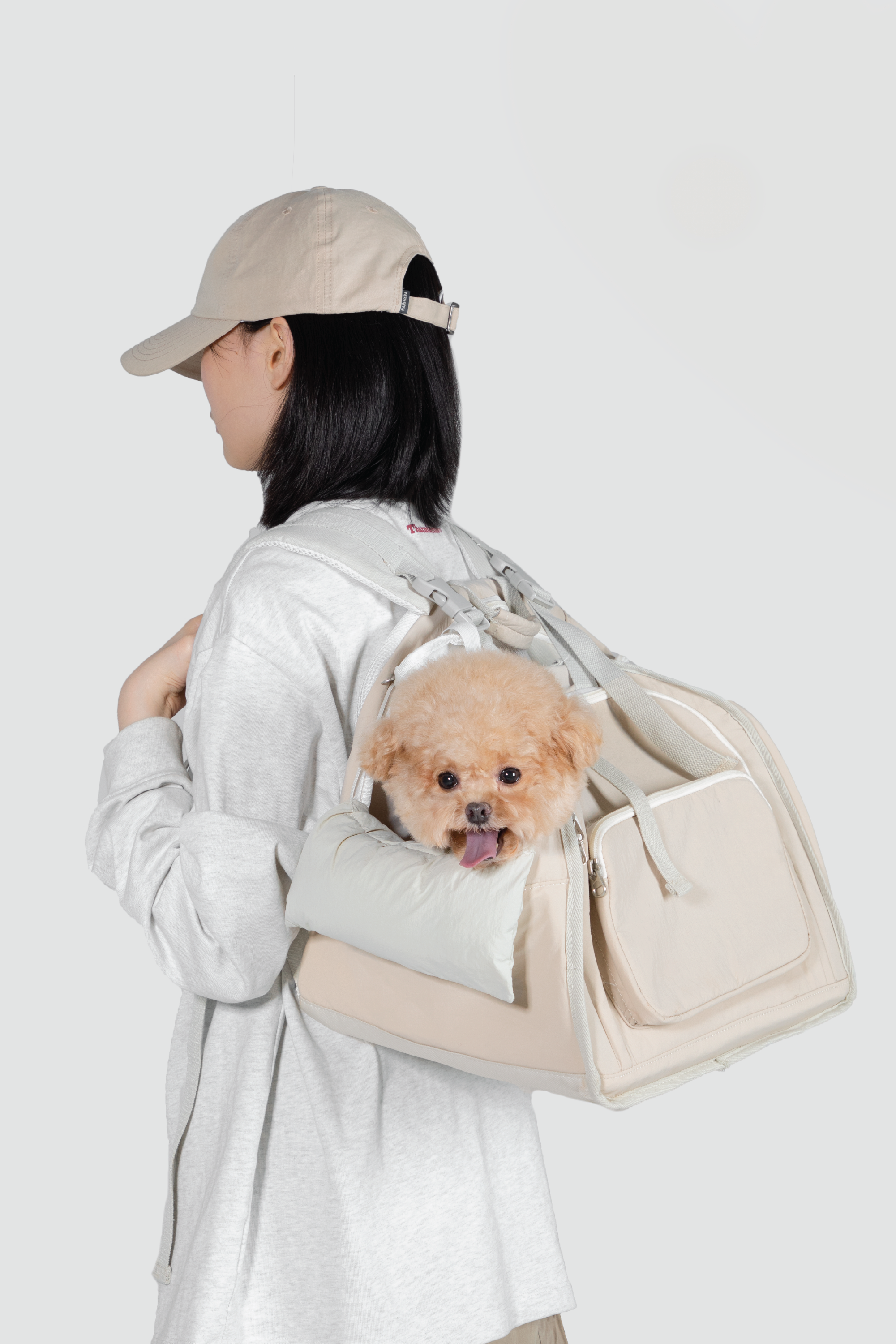 Shop Pawsitivity's Winter Pet Carrier, this pet carrier can be carried by hand or worn as a backpack. The luggage strap on the back makes it a breeze to attach to your suitcase for seamless travel. Made from waterproof nylon fabric to keep your pet dry and comfortable, even on rainy days. Pet Carriers Now On Sale, Shop Now!