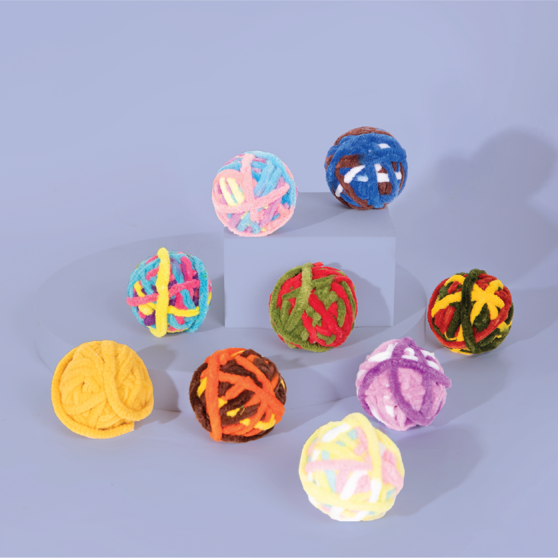 Pawsitivity's Pet Accessories: Whirlwind feline toy, vibrant colored textured yarn ball. Engaging cat entertainment, natural instincts stimulation.