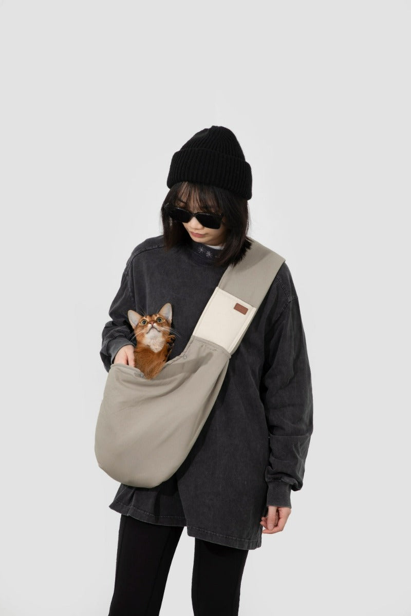 Explore the outdoors with your pet in Pawsitivity's portable all-season sling bag pet carrier! Enjoying every adventure with your cats & dogs. Convenient and stylish, perfect for on-the-go adventures. Colored in light grey with 100% cotton material, Order yours Today Now!