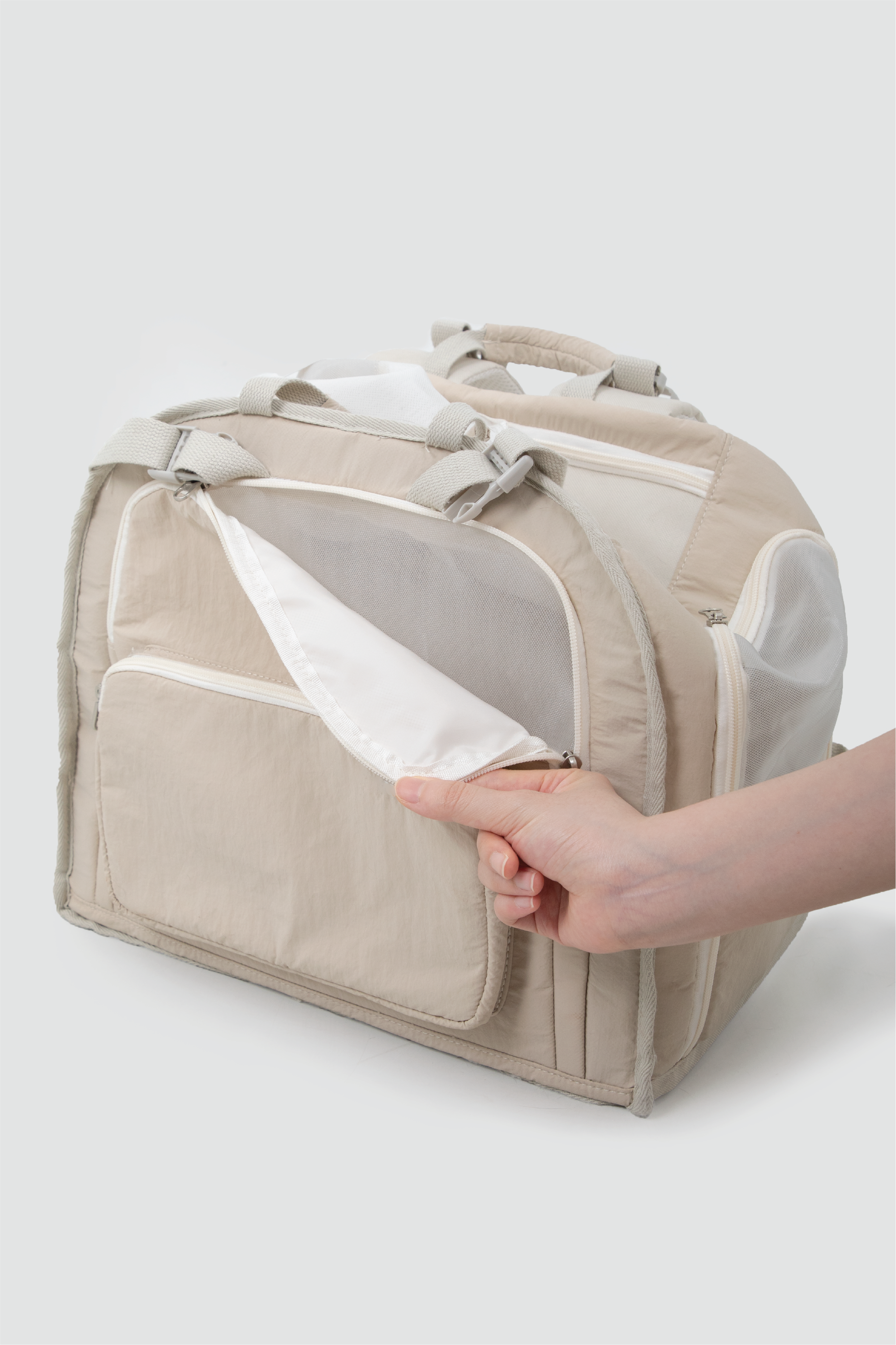 Shop Pawsitivity's Winter Pet Carrier, this pet carrier gives you the flexibility to carry it by hand or wear it as a backpack with padded handles and 7cm wide shoulder straps. A front mesh window ensures your pet gets plenty of fresh air and interaction, while the roll-up side opening enhances ventilation and visibility. Plus, the lightweight design helps reduce travel fatigue, making every trip easier for both you and your pet. Shop Now for Best Price!