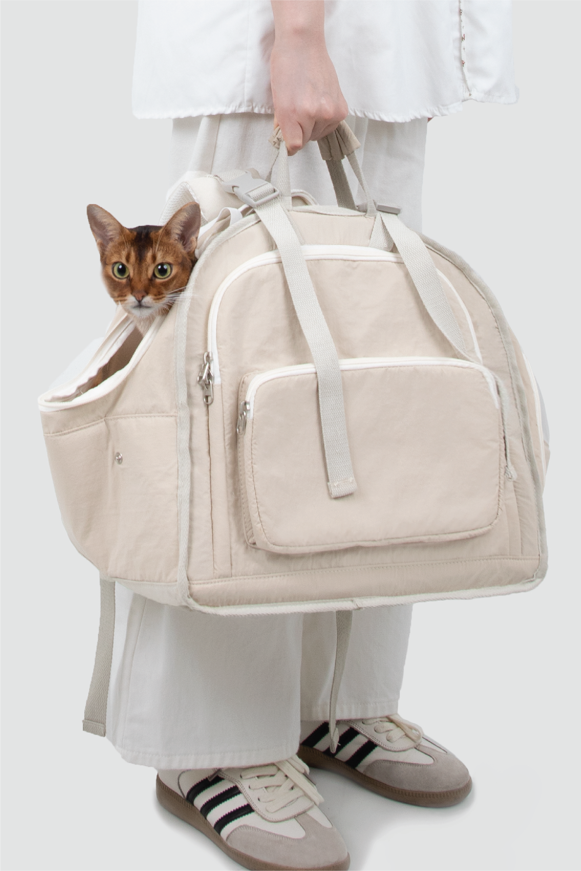 Shop Pawsitivity's Winter Pet Carrier, this pet carrier can be carried by hand or worn as a backpack. The luggage strap on the back makes it a breeze to attach to your suitcase for seamless travel. Made from waterproof nylon fabric to keep your pet dry and comfortable, even on rainy days. Shop Now for the Best Price!