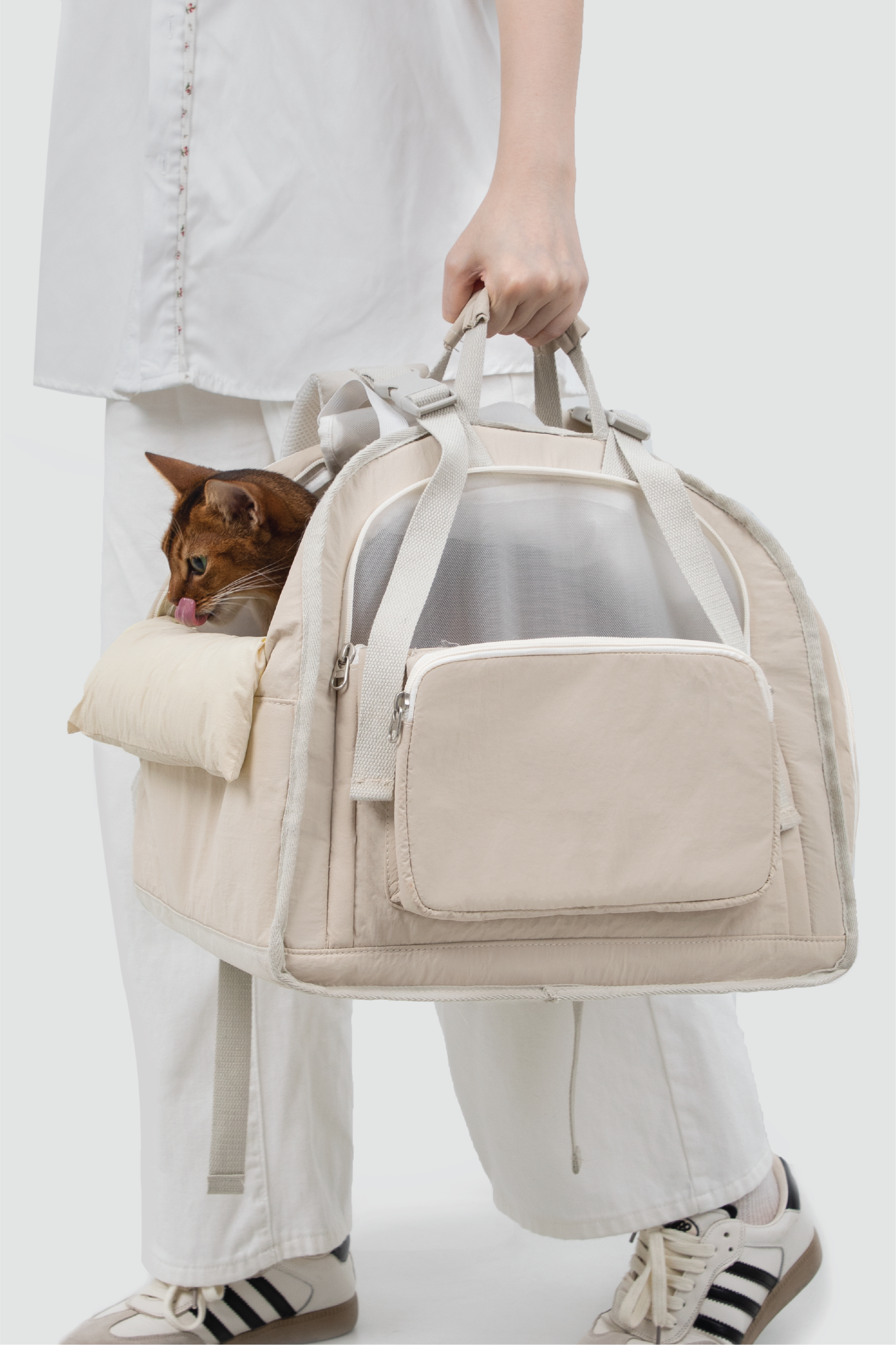 Shop Pawsitivity's Winter Pet Carrier, this pet carrier can be carried by hand or worn as a backpack. The luggage strap on the back makes it a breeze to attach to your suitcase for seamless travel. The front and roll-up side windows ensure interaction and airflow, keeping your pets safe and comfortable. Pet Carriers Now On Sale. Order Yours Today for the Best Price!